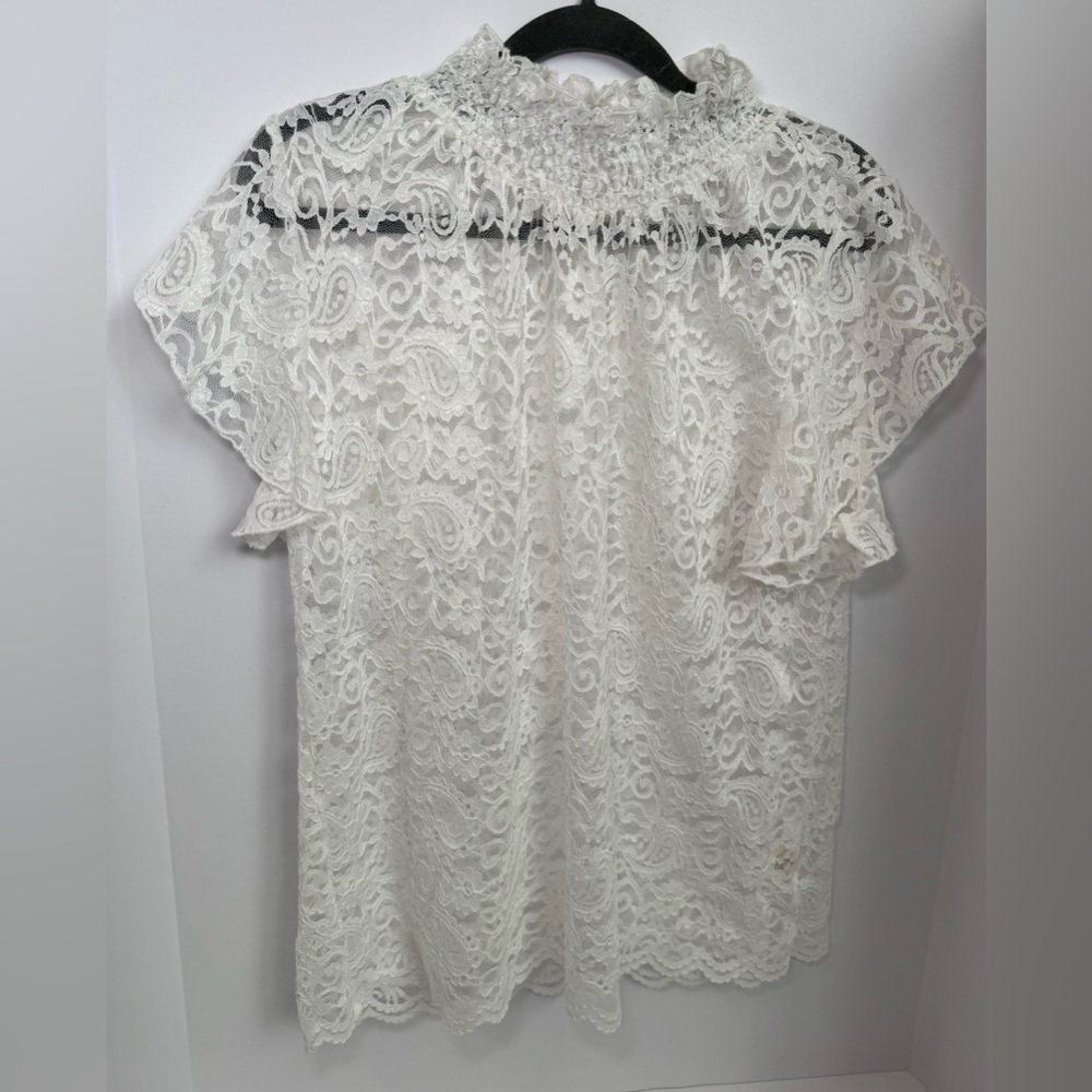 white floral lace blouse featuring flutter sleeves, a mock neck. Large